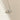 A silver chain necklace with a marquise-cut clear gemstone pendant, displayed on a warm beige background with soft shadows.