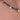 A close-up of a beaded necklace worn on skin, featuring dark blue faceted beads and small gold-toned round charms, with a small 'Pieces with a soul' watermark near the center.