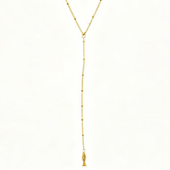 Gold necklace with a tassel on a white background