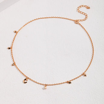 Close-up of moon and star charms on sterling silver necklace, 18k gold plated, celestial charm necklace detail