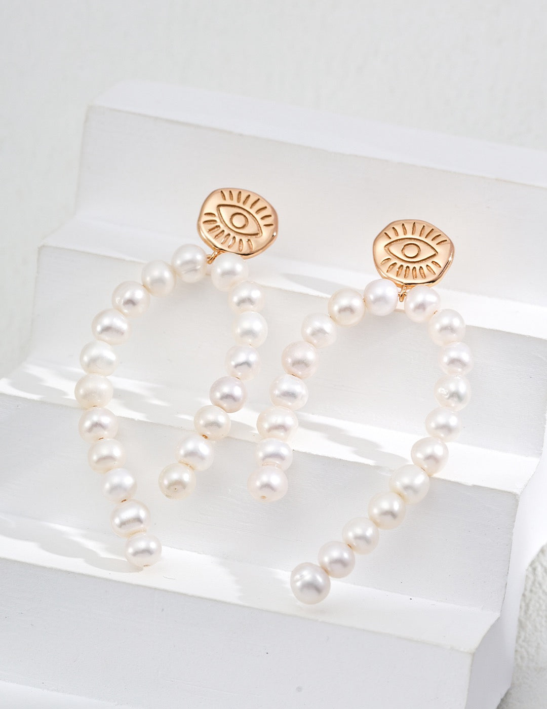 closed up details Earrings with freshwater pearls