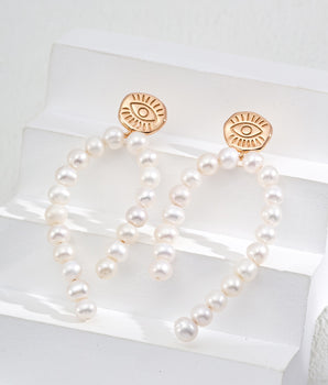 closed up details Earrings with freshwater pearls