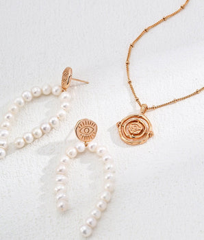 handcrafted Earrings with fine detaiis, featurings freshwater pearls, perfect for the summer outfit.