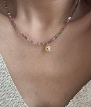 oman wearing the pink evil eye tourmaline and freshwater pearl necklace handcrafted in Denmark