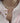Woman wearing pinkish natural pearl necklace close to collarbone casual elegant style