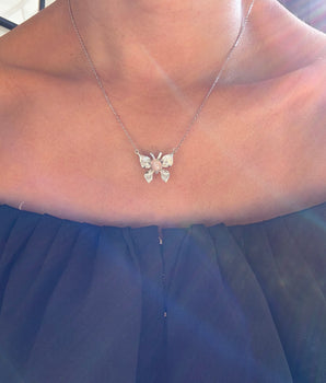 Necklace with a butterfly pendant on a girls Necklace 