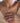 A models the dainty feather necklace with natural opal, showcasing the gold plated Necklace.