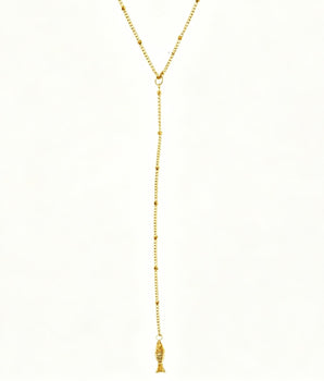 Gold necklace with a tassel on a white background
