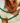 Woman wearing a malachite pearl choker, the green stone evoking Nordic spring forests.