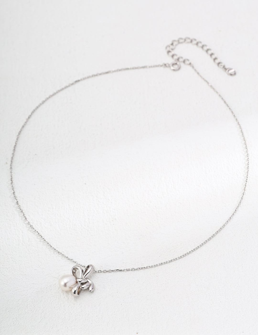 Elegant Ophelia pearl bow necklace on Silver Chain 