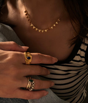 Nordic serrated necklace worn with neutral cashmere, embodying understated elegance for everyday wear